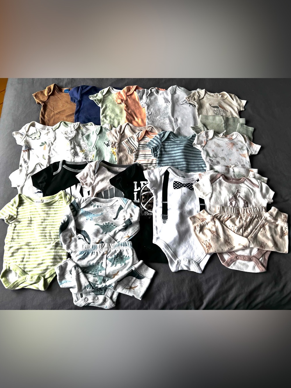 Bundle of 24 onesies 0-3 month size, different brands